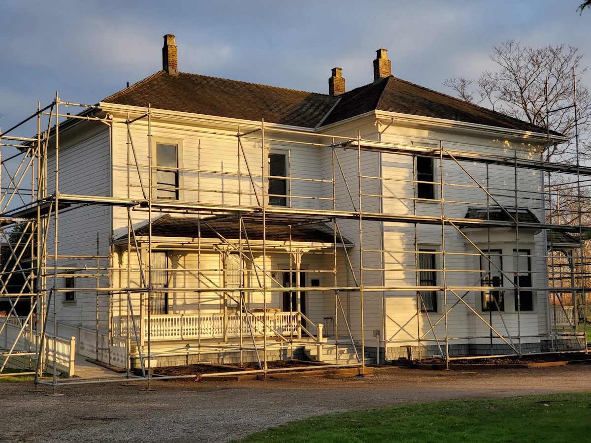 House under scaffolding during renovation