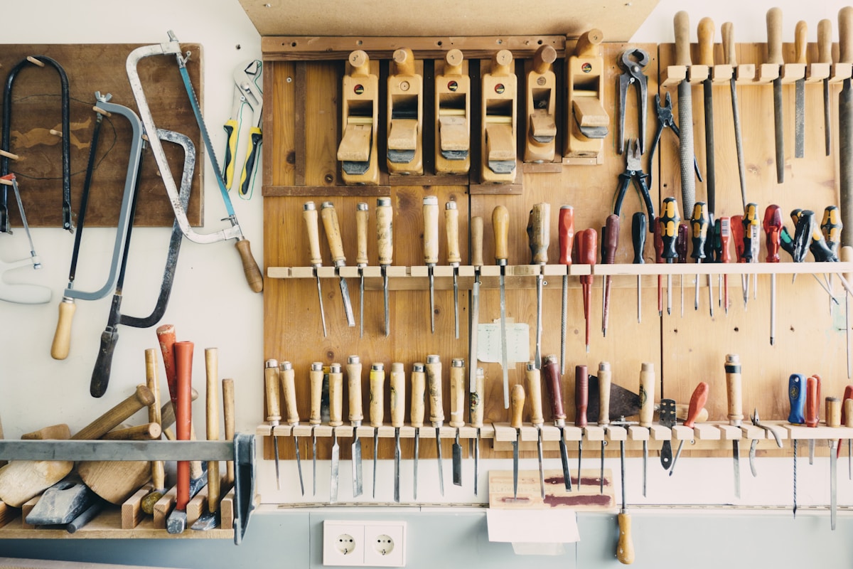Carpenter's tools arranged in a workshop rack